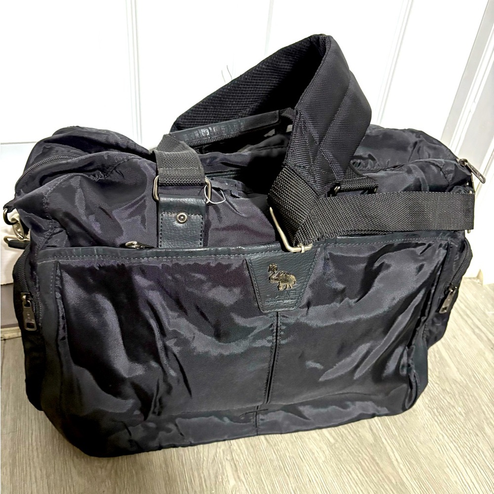 Black Duffel Bag with silver Hardware and Structured Design.